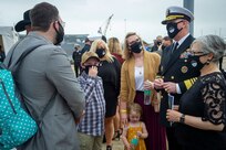 Adm. Christopher Grady, commander, U.S. Fleet Forces Command, speaks with Gold Star families following the Arleigh Burke-class guided missile destroyer USS Cole (DDG 67) 20th Anniversary memorial ceremony at Naval Station Norfolk.