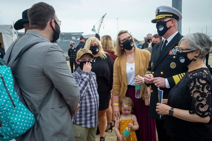 Adm. Christopher Grady, commander, U.S. Fleet Forces Command, speaks with Gold Star families following the Arleigh Burke-class guided missile destroyer USS Cole (DDG 67) 20th Anniversary memorial ceremony at Naval Station Norfolk.