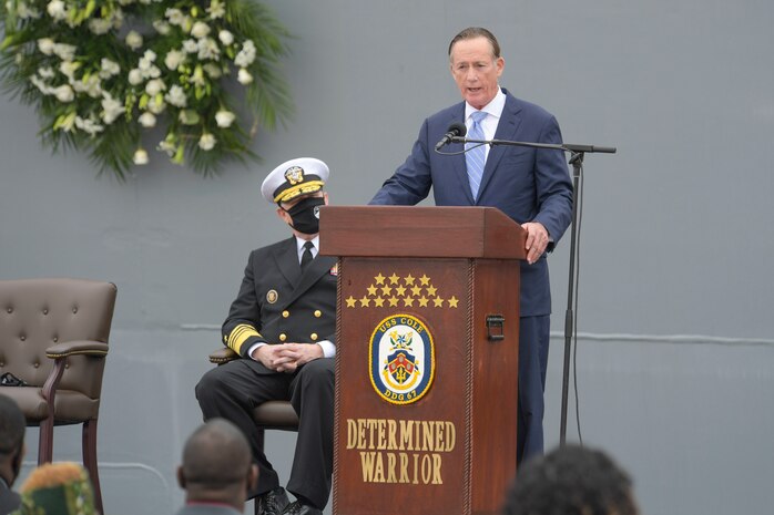 Adm. (ret.) Robert Natter, U.S. Atlantic, U.S. Fleet Forces Command, speaks at the Arleigh Burke-class guided missile destroyer USS Cole (DDG 67) 20th Anniversary memorial ceremony at Naval Station Norfolk.