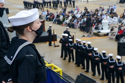 NORFOLK (Oct. 12, 2020) Sailors aboard the Arleigh Burke-class guided missile destroyer USS Cole (DDG 67) stand at parade rest during the 20th Anniversary memorial ceremony onboard Naval Station Norfolk. USS Cole was attacked by terrorists at 11:18 a.m. on Oct. 12, 2000, while moored for refueling in the Port of Aden, Yemen. The explosive bomb created a 40-by-60-foot hole on the port side of the ship, and the Cole's Sailors fought fires and flooding for the following 96 hours to keep the ship afloat. Commemoration events on the 20th anniversary of the attack remember and honor the 17 Sailors who were killed, the 37 who were injured and the Gold Star families. (U.S. Navy photo by Mass Communication Specialist Jacob Milham)