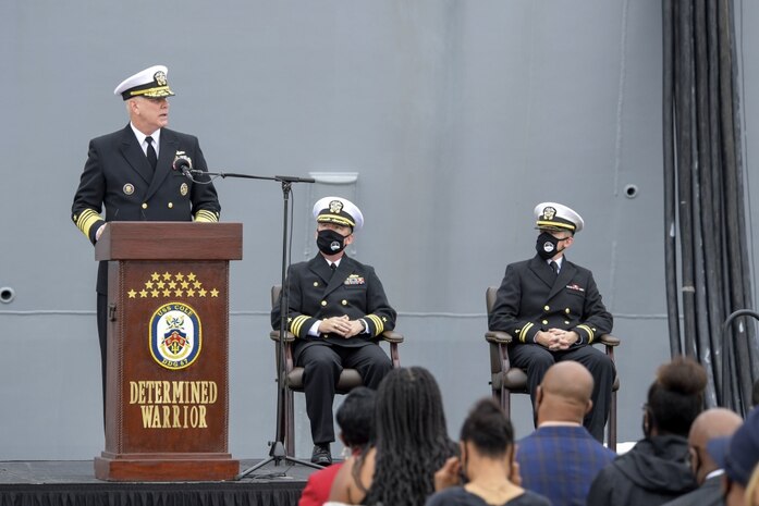 NORFOLK (Oct. 12, 2020) Adm. Christopher Grady, Commander, U.S. Fleet Forces Command, speaks at the Arleigh Burke-class guided missile destroyer USS Cole (DDG 67) 20th Anniversary memorial ceremony at Naval Station Norfolk. USS Cole was attacked by terrorists at 11:18 a.m. on Oct. 12, 2000, while moored for refueling in the Port of Aden, Yemen. The explosive bomb created a 40-by-60-foot hole on the port side of the ship, and the Cole's Sailors fought fires and flooding for the following 96 hours to keep the ship afloat. Commemoration events on the 20th Anniversary of the attack remember and honor the 17 Sailors who were killed, the 37 who were injured and the Gold Star families. (U.S. Navy photo by Mass Communication Specialist 2nd Class Darien G. Kenney)