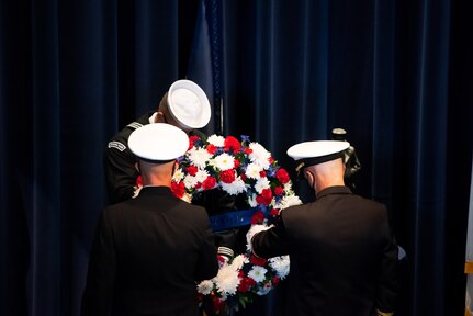 Vice Adm. James Kilby, deputy chief of naval operations, warfighting requirements and capabilities, and Rear Adm. Carl Lahti, commandant of Naval District Washington, place a wreath at the Navy Memorial Burke Theater commemorating the 20th anniversary of the attack on the U.S. Navy guided-missile destroyer USS Cole (DDG 67), Oct. 12.