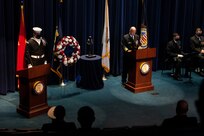 Vice Adm. James Kilby, deputy chief of naval operations, warfighting requirements and capabilities, delivers remarks during a wreath-laying ceremony at the Navy Memorial Burke Theater commemorating the 20th anniversary of the attack on the U.S. Navy guided-missile destroyer USS Cole (DDG 67), Oct. 12.