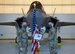U.S. Air Force Col. Matthew Powell, the 354th Maintenance Group commander, awards Tech. Sgt. Theodore Crowely, III, a 354th Aircraft Maintenance Squadron F-35A Lightning II dedicated crew chief (DCC), the title of DCC on Eielson Air Force Base, Alaska, Oct. 9, 2020. The purpose of the DCC program is to provide continuity and accuracy by assigning ownership of each aircraft to a maintainer. (U.S. Air Force photo by Senior Airman Beaux Hebert)