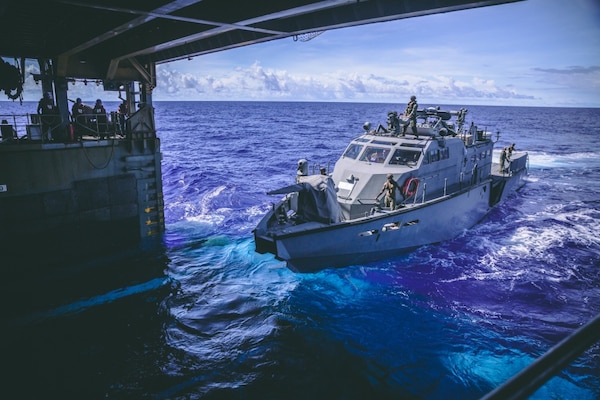 PB Mk VI 1206 assigned to Maritime Expeditionary Security Squadron 3 prepares to board the amphibious dock landing ship USS Comstock (LSD 45), Oct. 4, 2020. Maritime Expeditionary Security Force and Explosive Ordnance Disposal Mobile Unit Sailors assigned to Commander, Task Force 75 (CTF 75) embarked and are conducting integrated littoral maritime security operations from the amphibious dock landing ship USS Comstock (LSD 45) with the Marines and Sailors already deployed as Task Force Ellis from I Marine Expeditionary Force. PB Mk VI provides increased capabilities to amphibious warships and can operate directly in support of the Navy platform or independently in support of mission tasking. (U.S. Marine Corps photo by Sgt. Manuel A. Serrano)