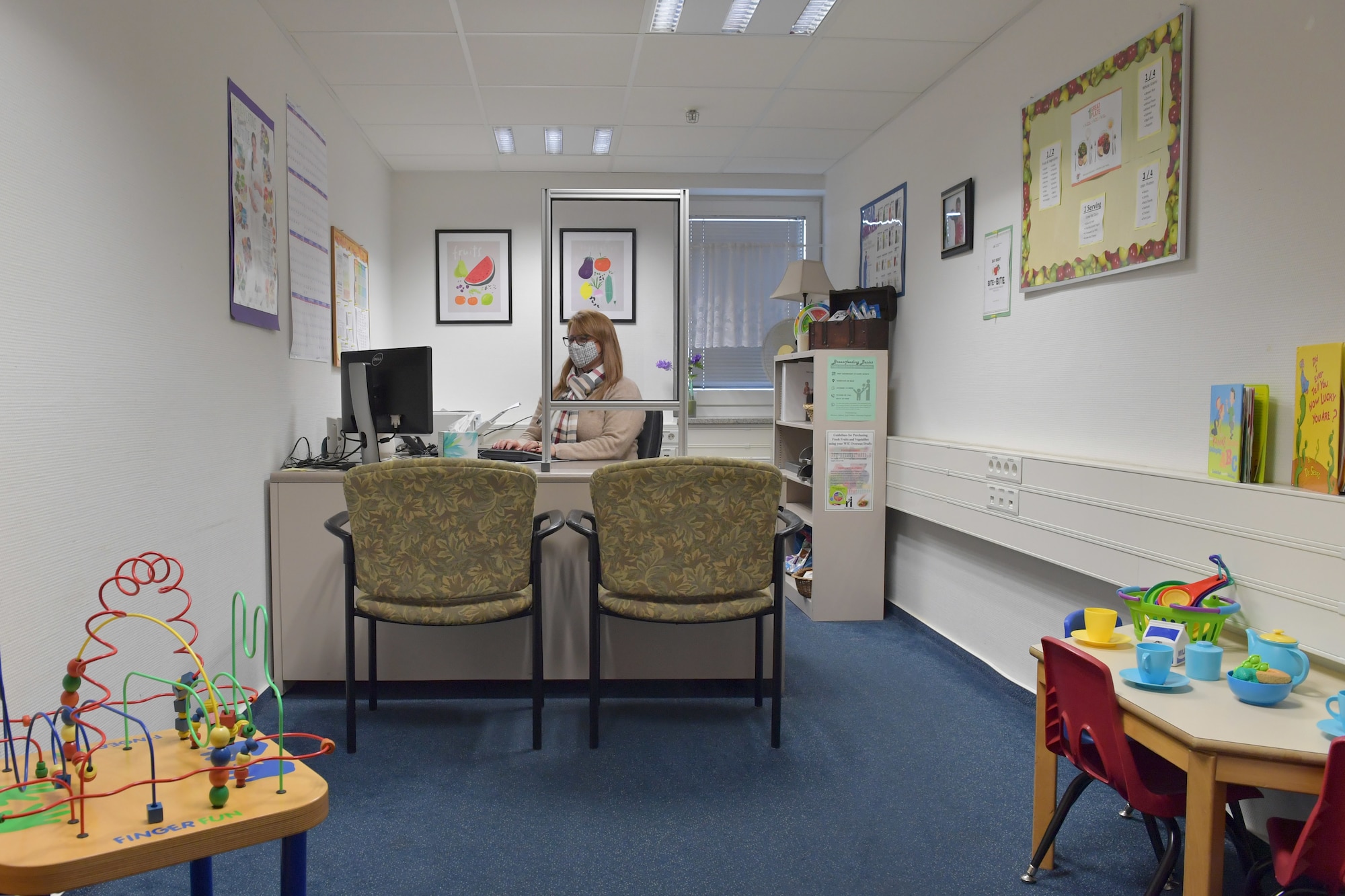 A woman sitting at a desk.