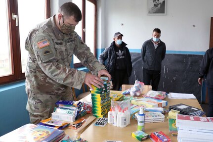 Maj. Chad Plaisted, with the Oregon Army National Guard 41st Infantry Brigade Combat Team, delivers donated supplies to an underserved primary school Oct. 6, 2020, in Bivolak/Bivoljak, Kosovo. Plaisted and other 41st IBCT Soldiers have been deployed in Kosovo since the beginning of 2020 as members of the U.S.-led brigade level KFOR Regional-Command East.