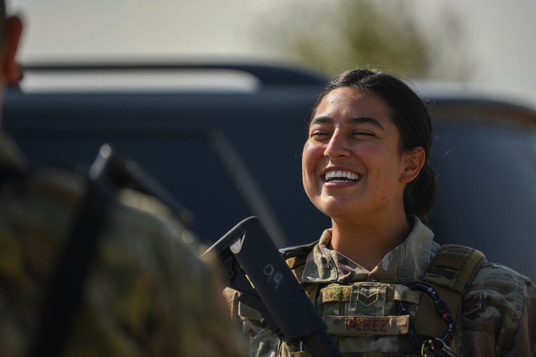 Senior Airman Monica Perez, 31st Security Forces Squadron noncommissioned officer in charge of reports and analysis, smiles in a conversation during NATO’s enhanced Air Policing Allied mission at Graf Ignatievo Air Base, Bulgaria, Oct. 12, 2020. One of NATO’s roles is to preserve the integrity of allied airspace. The 31st SFS’s participation in eAP provided an opportunity for them to demonstrate comprehensive deterrence and defense through joint and combined interoperability. (U.S. Air Force photo by Airman 1st Class Ericka A. Woolever)