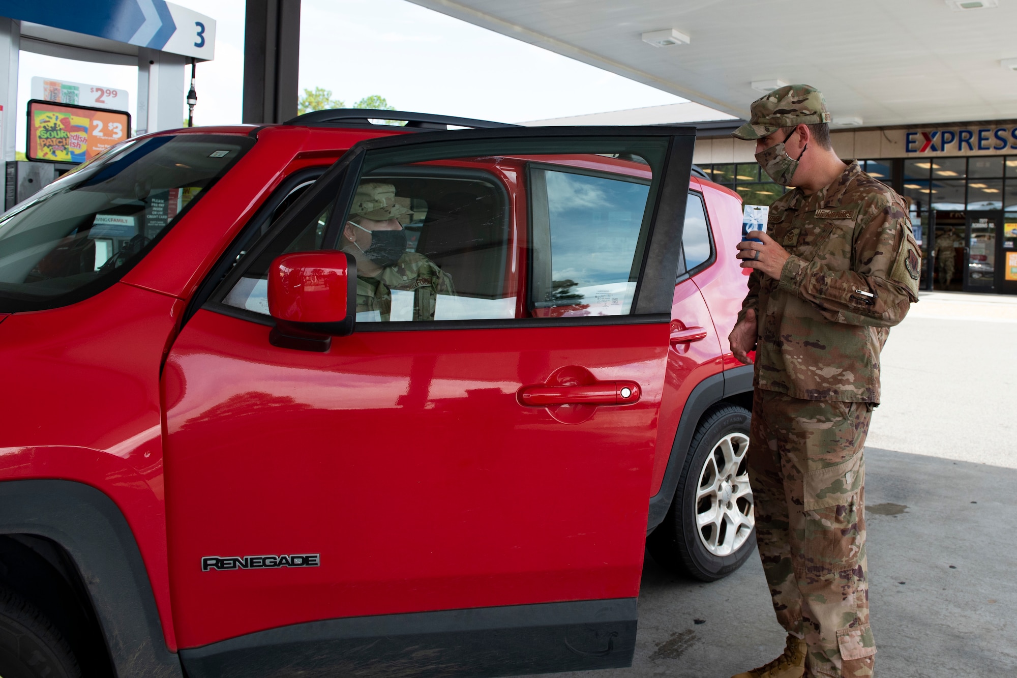 A photo of a sergeant talking to an Airman.