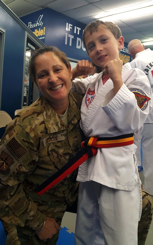 Col. Leslie Hadley, 403rd Wing vice commander, celebrates with her son, Michael, after he earned his belt promotion in Taekwondo. (Courtesy photo by Col. Leslie Hadley)