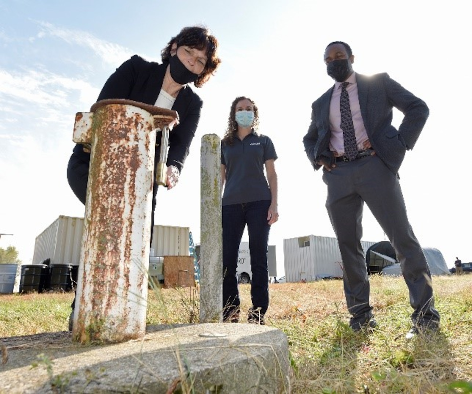 From left, Treva Bashore, restoration program manager, AFCEC/CZOM Civil Engineer Center, Rebecca Mora, project manager, AECOM, and Amir Mott, deputy director, 88th Civil Engineer Group,  discuss where the PFAS-contaminated groundwater was extracted at the fire training area of Wright-Patterson Air Force Base, Ohio on Sept. 29, 2020. U.S. Air Force personnel from the Air Force Civil Engineer Center are leading a pilot study of new remediation techniques that can remove and destroy per- and polyfluoroalkyl substances (PFAS) from contaminated groundwater. PFAS is a group of chemicals, some of which were formerly used in aircraft fire fighting foam. (U.S. Air Force photo by Ty Greenlees)