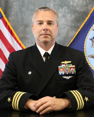 Commander Tim L. Raymie