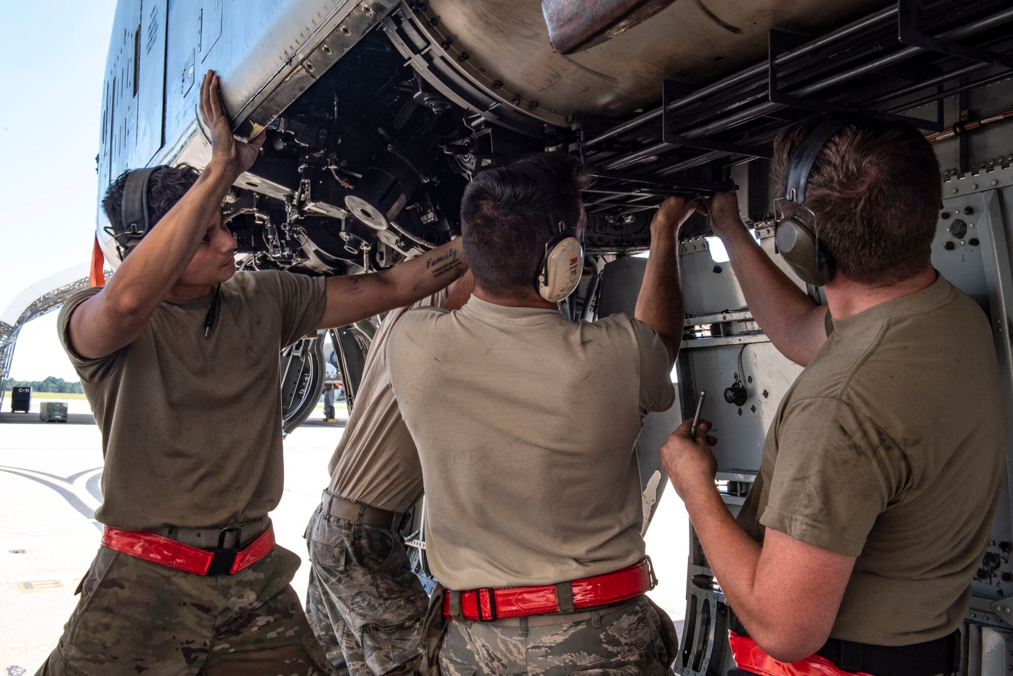 A photo of Airmen  installing the GAU-8 Avenger’s timing gears on an A-10C Thunderbolt II.
