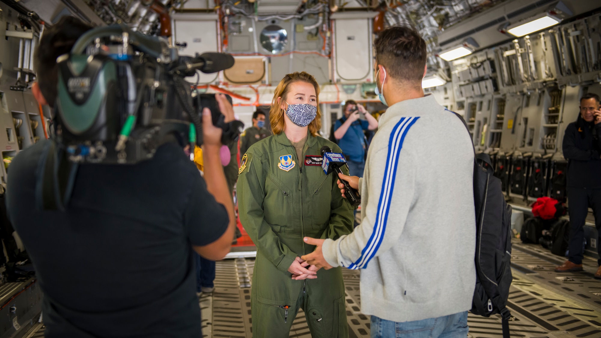Staff Sgt. Kori Myers, 418th Flight Test Squadron C-17 load master, is interviewed by a local news agency prior to a media flight during the 2020 Aerospace Valley Air Show at Edwards Air Force Base, Oct. 9. (Air Force photo by Giancarlo Casem)