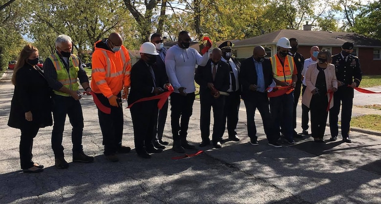 USACE Chicago District Commander Col. Paul Culberson, Rep. Robin Kelly (IL-2), Hazel Crest Mayor Vernard Alsberry Jr., and others cut a ceremonial ribbon during a ceremony to mark the completion of a water main project in Hazel Crest, Illinois, Oct. 13, 2020.