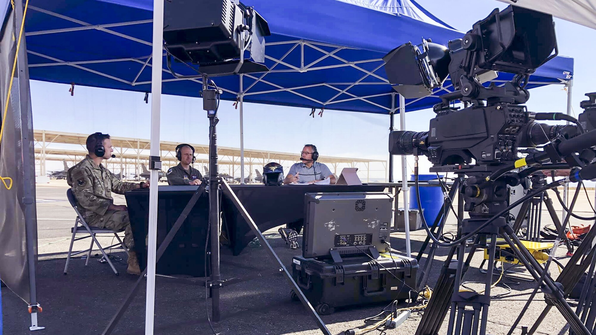 Command Chief Master Sgt. Ian Eishen, 412th Test Wing Command Chief Master Sergeant, and Brig. Gen. Matthew Higer, 412th Test Wing Commander, provide commentary during a live broadcast of the the 2020 Aerospace Valley Air Show at Edwards Air Force Base, Oct. 10. (Air Force photo by Crosby Shaterian)