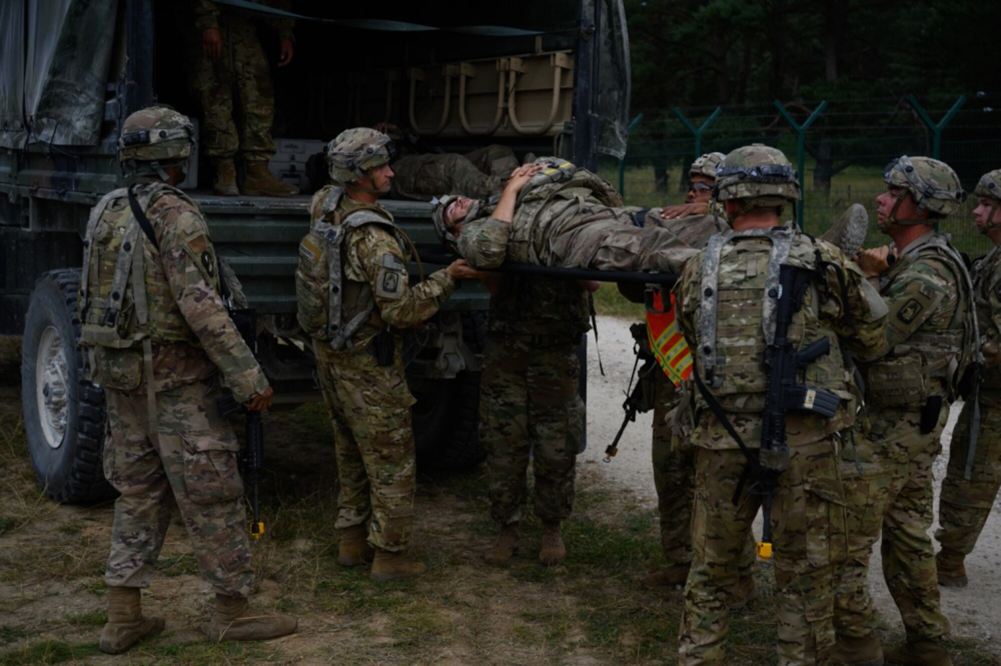 U.S. Air Force Senior Airman Derrick Hargrove, 7th Combat Weather Squadron, Weather Operations Flight weather forecaster, is hoisted by fellow Airmen during a field training exercise.