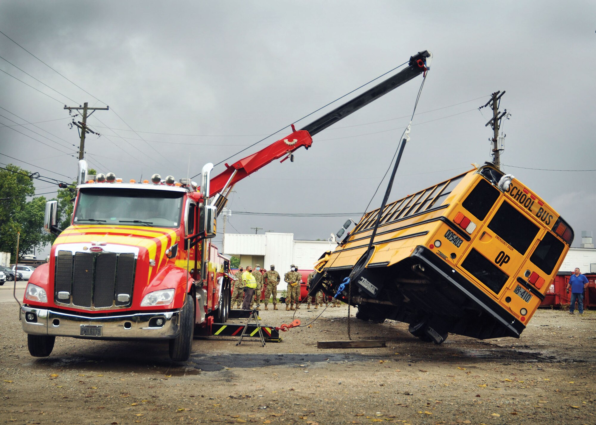 Reserve Citizen Airmen from the 445th Logistics Readiness Squadron perform recovery training on a 44-passenger bus at Sandy’s Towing, Recovery & Carrier Service in Dayton, Ohio, Sept. 13, 2020. Airmen gained hands on training of proper and safe use of wrecker vehicles and recovery procedures.