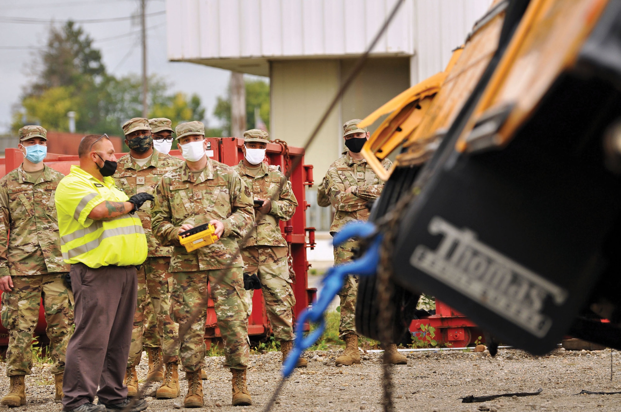 Reserve Citizen Airmen from the 445th Logistics Readiness Squadron perform recovery training on a 44-passenger bus at Sandy’s Towing, Recovery & Carrier Service in Dayton, Ohio, Sept. 13, 2020. Airmen gained hands on training of proper and safe use of wrecker vehicles and recovery procedures.