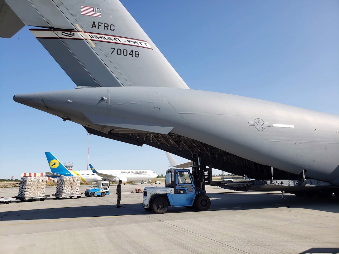 Reserve Citizen Airmen from the 445th Airlift Wing’s 89th Airlift Squadron unload more than 50,000 pounds of food and essential supplies at the Kyiv Boryspil International Airport, Ukraine, Sept. 19, 2020, as part of the Denton Humanitarian Assistance Program the 445th supported. The cargo included 285,120 high-protein meals and 52,800 water purifying packets from A Child’s Hope International based in Cincinnati, Ohio.