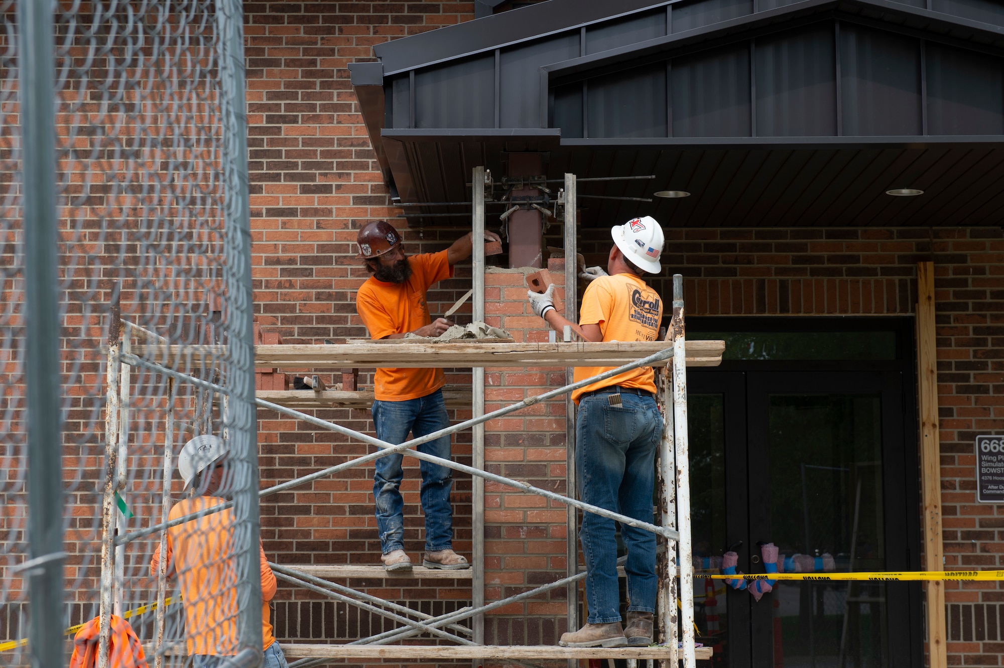 Contractors lay bricks at Grissom Air Reserve Base, Indiana, Sept. 23, 2020. The 434th Civil Engineering are working to repair multiple facilities throughout the base. (U.S. Air Force photo by Staff Sgt. Michael Hunsaker)