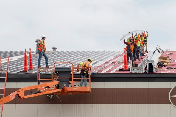 Contractors replace the roof of Dock 1 at Grissom Air Reserve Base, Indiana, Sept. 23, 2020. Repairing the dock roofs are part of the many projects the 434th Civil Engineering are working on throughout Grissom. (U.S. Air Force photo by Staff Sgt. Michael Hunsaker)