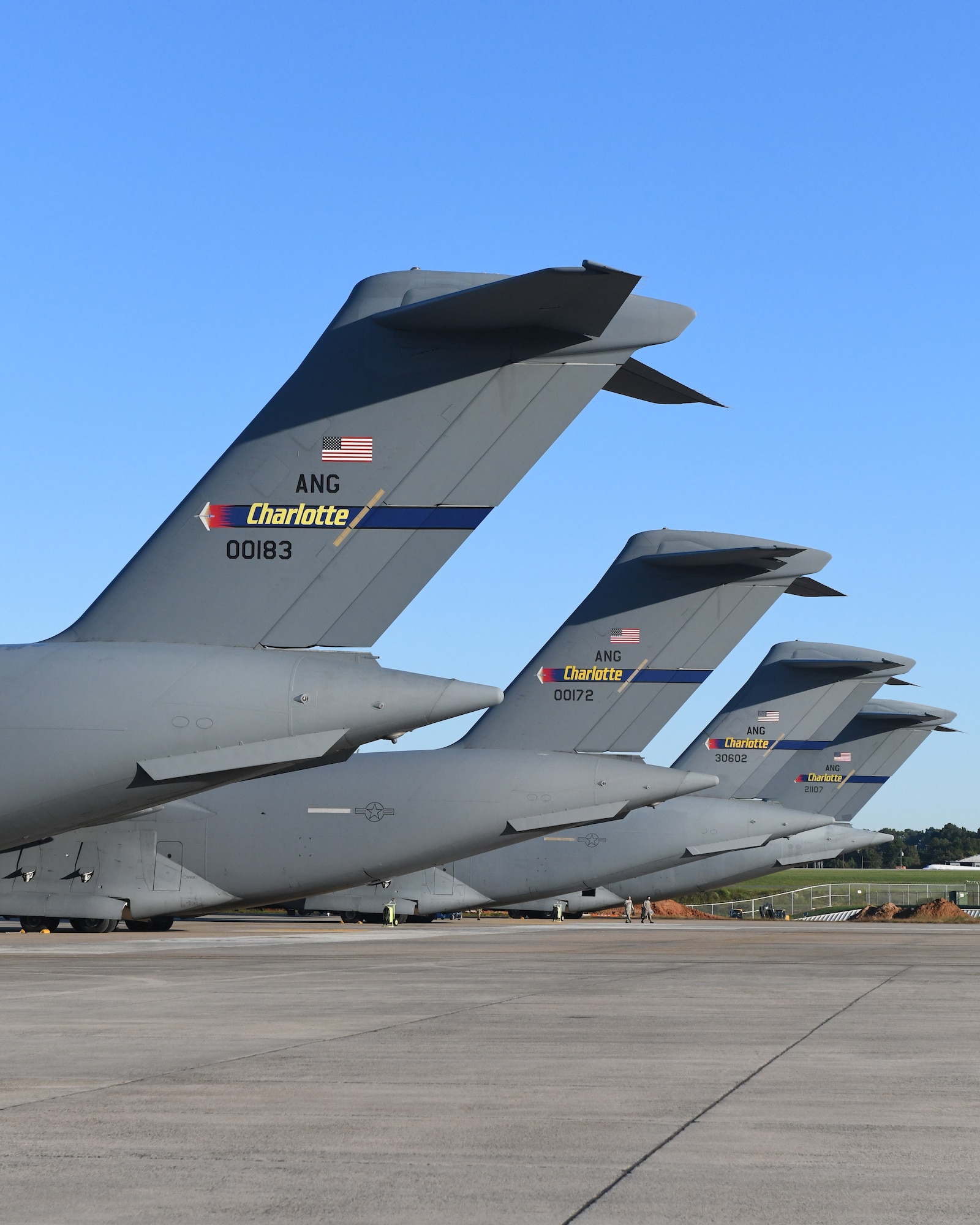 Five C-17 Globemaster III Aircraft belonging to the 145th Airlift Wing are parked in a row on a sunny day at the  North Carolina Air National Guard Base, Charlotte Douglas International Airport, October 14, 2020. The 145th Airlift Wing began converting from C-130 Hercules to the C-17 in October of 2017 and officially exited conversion in October 2020.