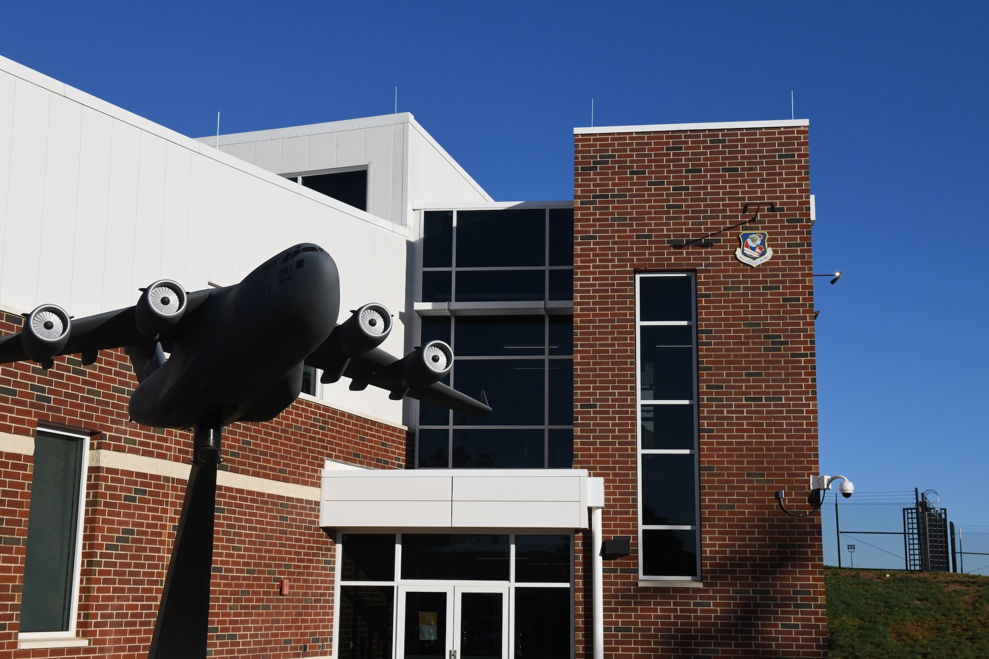 The front entrance of the 145th Operations Group building, constructed as part of the C-17 conversion for the 145th Airlift Wing, it was the first building to be completed during the conversion process, at the  North Carolina Air National Guard Base, Charlotte Douglas International Airport, October 14, 2020. The 145th Airlift Wing began converting from C-130 Hercules to the C-17 in October of 2017 and officially exited conversion in October 2020.