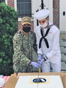 Capt. Marc Ratkus (left), commanding officer of the Center for Information Warfare Training (CIWT), and Information Systems Technician Seaman Conrad Birmingham, a student attached to Information Warfare Training Command Corry Station, cut a cake in honor of the Navy’s 245th birthday onboard Naval Air Station Pensacola Corry Station, Pensacola, Florida.