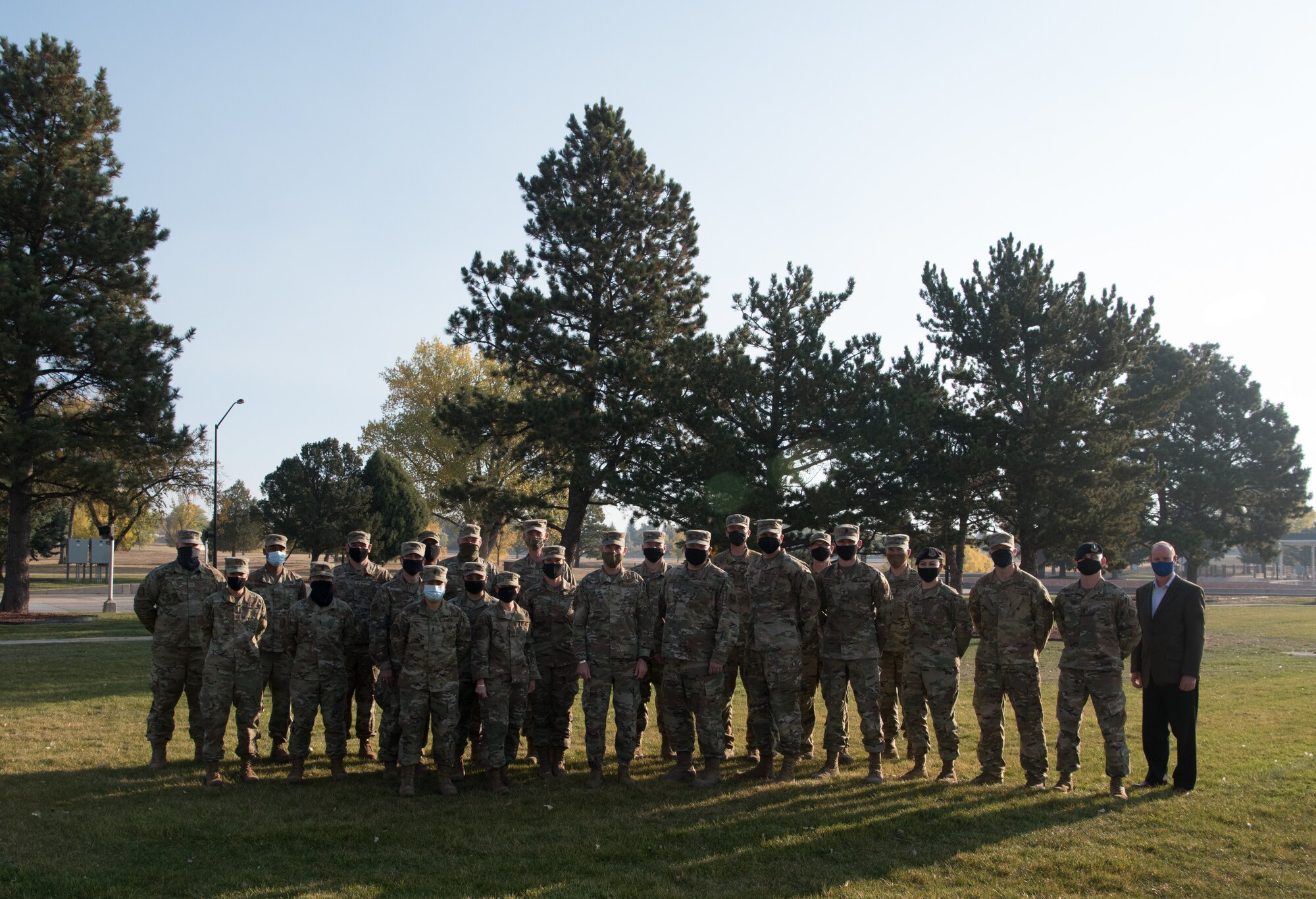 Airmen pose for a photo.