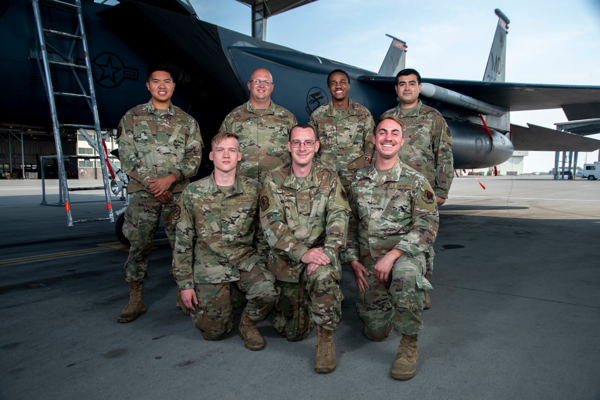 389th Fighter Squadron weapons load crew members pose in-front of an F-15E Strike Eagle, Oct. 8, 2020, at Mountain Home Air Force Base, Idaho. Integrated Combat Turns are a rapid re-arming and refueling practice where both fuels and weapons troops work side-by-side to turn aircraft around and get them back into the skies. (U.S. Air Force photo by Senior Airman JaNae Capuno)