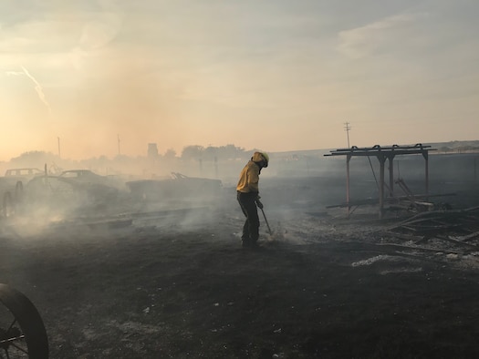 A fire fighter responds to a wildland fire Oct. 8, 2020, near Fort Shaw, Mont.