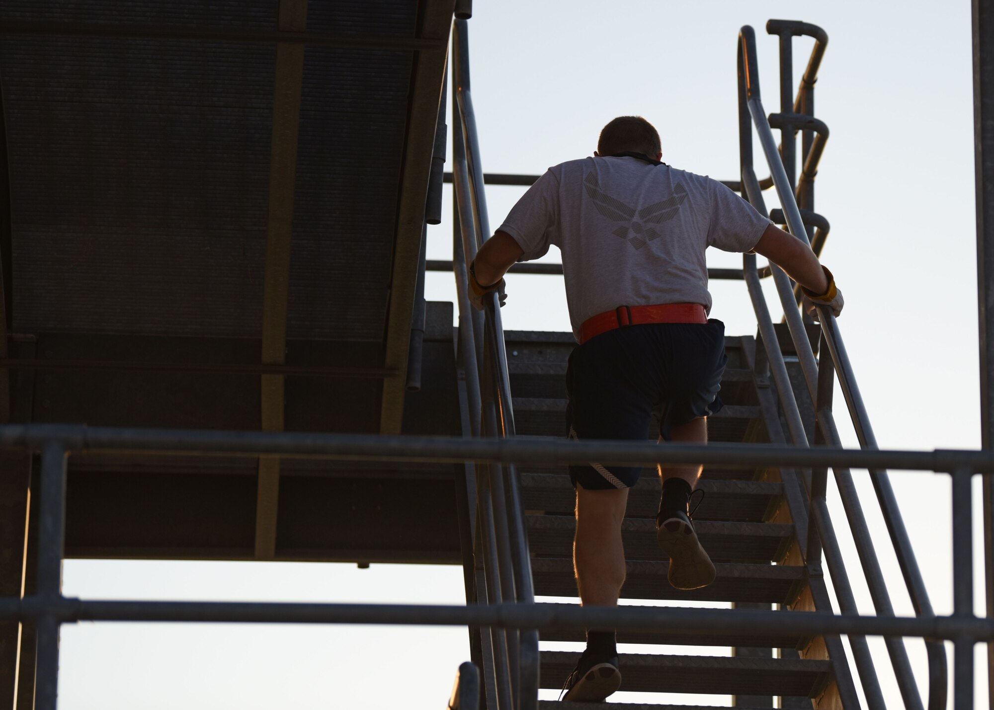 A 312th Training Squadron student runs up a flight of stairs during Blood, Sweat, and Stairs at the Louis F. Garland Department of Defense Fire Academy, on Goodfellow Air Force Base, Texas, Oct. 10, 2020. There were 2,226 steps in the world trade center; in memory of that, a huge part of the competition is made of stairs. (U.S. Air Force photo by Airman 1st Class Ethan Sherwood)