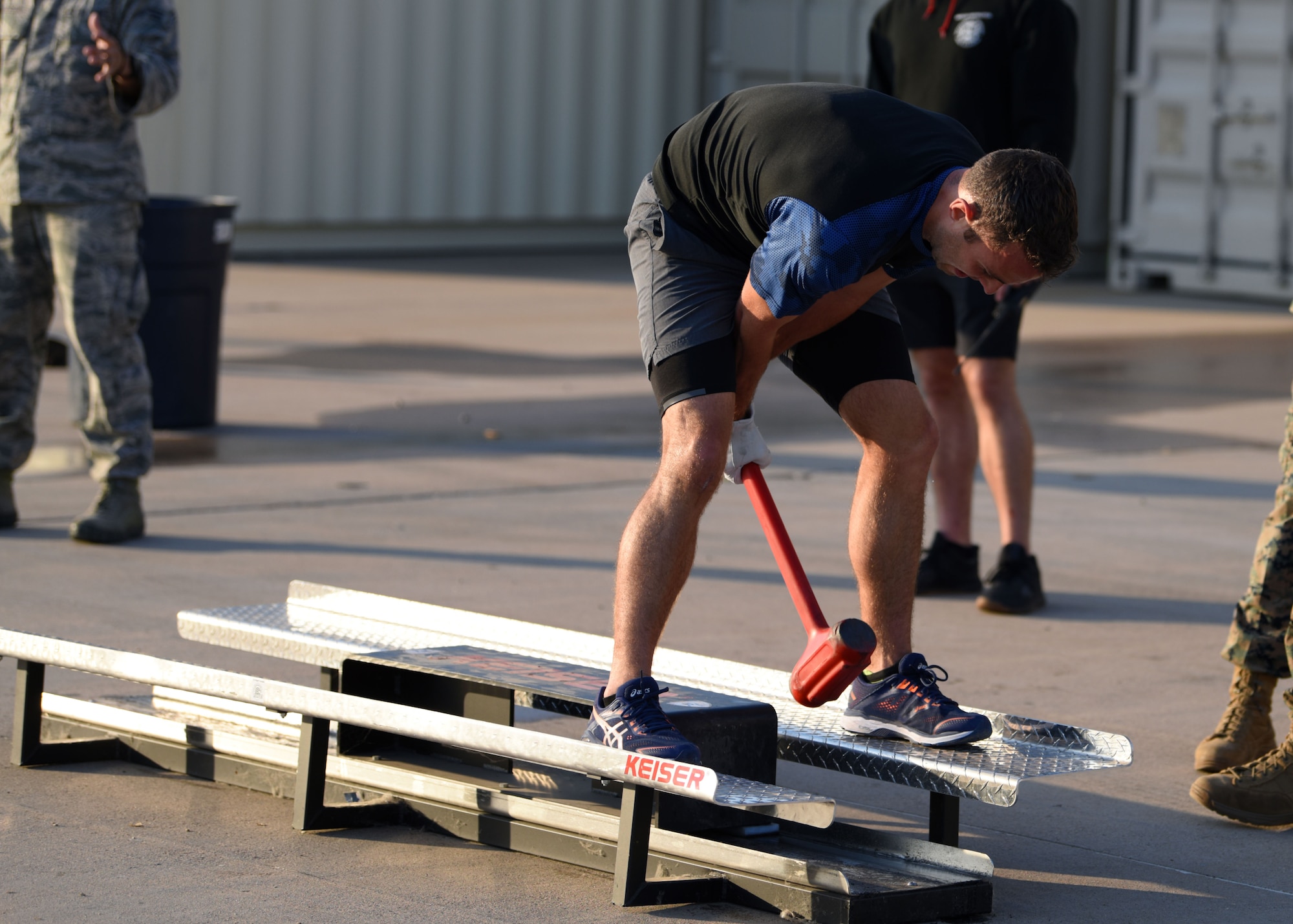 U.S. Air Force Airman 1st Class Ian Loveall, 312th Training Squadron student, uses the Keiser sled during Blood, Sweat, and Stairs at the Louis F. Garland Department of Defense Fire Academy, on Goodfellow Air Force Base, Texas, Oct. 10, 2020. The Keiser sled represented first responders using tools to break down doors and through rubble during 9/11. (U.S. Air Force photo by Airman 1st Class Ethan Sherwood)