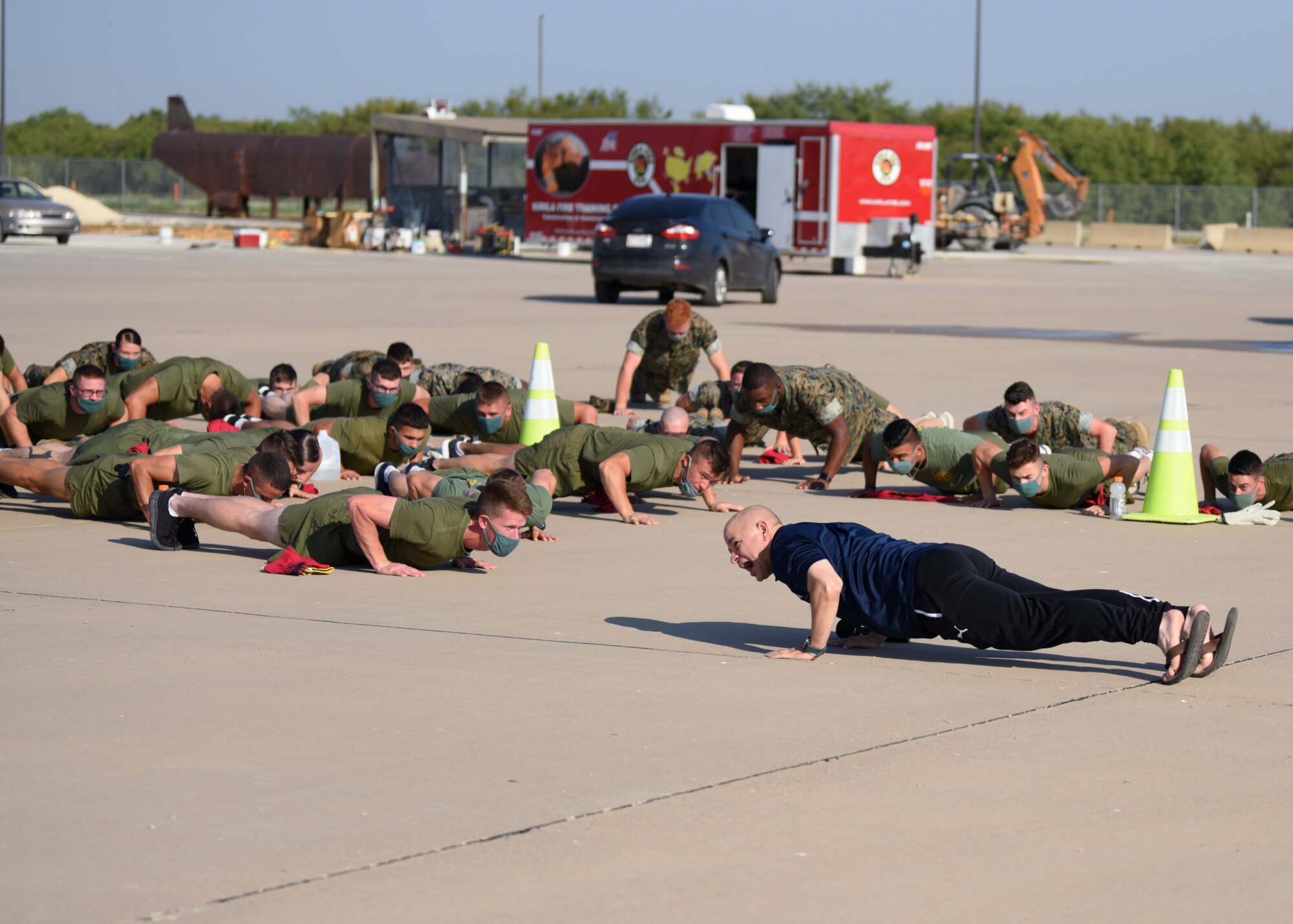 U.S. Air Force Col. Andres Nazario, 17th Training Wing commander, performed pushups with participants of Blood, Sweat, and Stairs at the Louis F. Garland Department of Defense Fire Academy, on Goodfellow Air Force Base, Texas, Oct. 10, 2020. The pushups were used to honor those who paid the ultimate sacrifice and those who were willing to do the same. (U.S. Air Force photo by Airman 1st Class Ethan Sherwood)