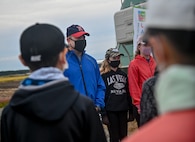 Students from Oozora Elementary School greet U.S. Air Force Col. Jesse J. Friedel, 35th Fighter Wing commander, and his family during a community relations event in Misawa City, Japan, Oct. 8, 2020. Friedel and Misawa Mayor Yoshinori Kohiyama joined the students on their trip to harvest rice. (U.S. Air Force photo by Tech. Sgt. Timothy Moore)