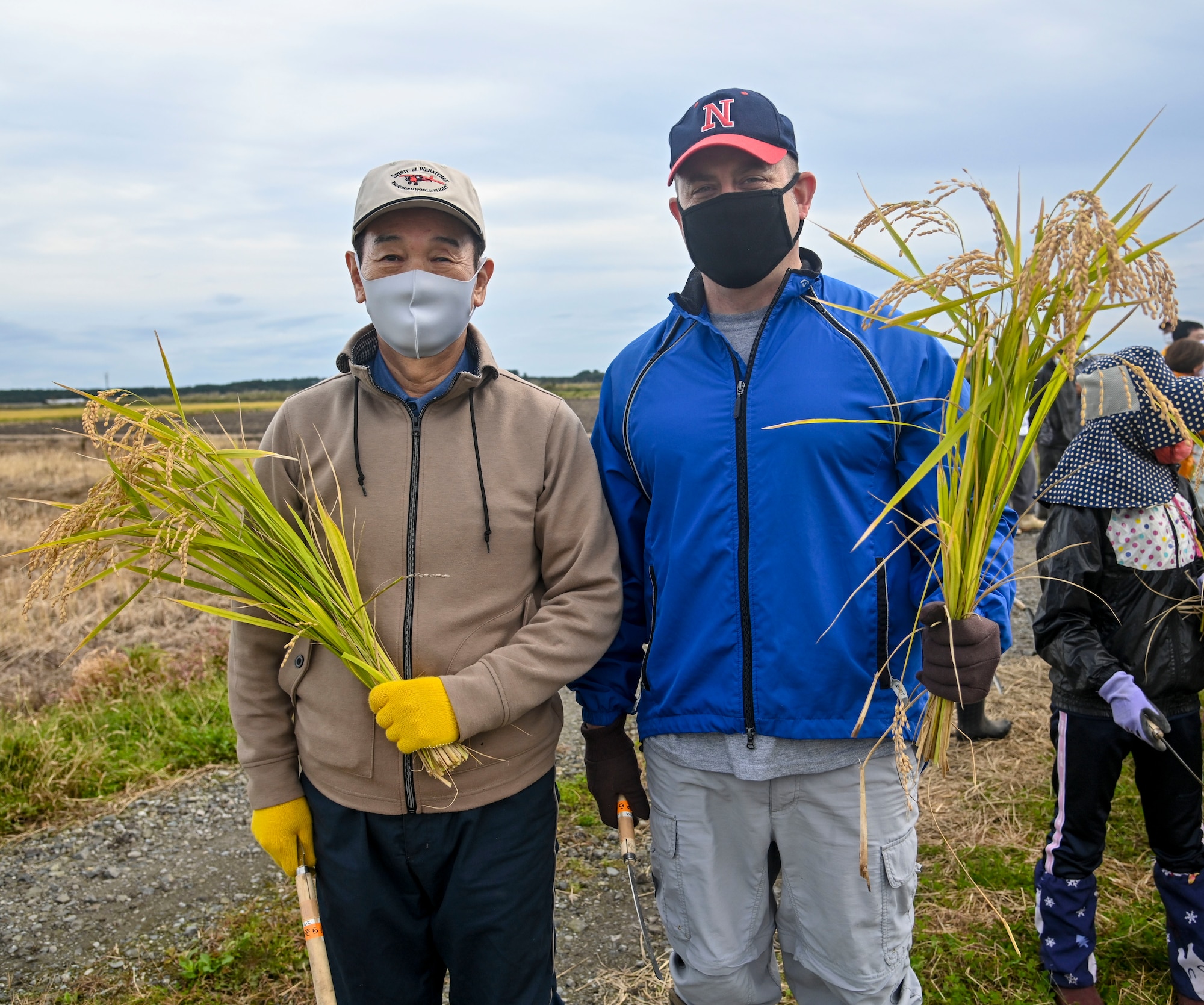 Misawa Mayor Yoshinori Kohiyama, left, and U.S. Air Force Col. Jesse J. Friedel, 35th Fighter Wing commander, pose for a photo during a community relations event in Misawa City, Japan, Oct. 8, 2020. Kohiyama and Friedel joined students from Oozora Elementary School to harvest rice. (U.S. Air Force photo by Tech. Sgt. Timothy Moore)