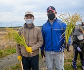 Misawa Mayor Yoshinori Kohiyama, left, and U.S. Air Force Col. Jesse J. Friedel, 35th Fighter Wing commander, pose for a photo during a community relations event in Misawa City, Japan, Oct. 8, 2020. Kohiyama and Friedel joined students from Oozora Elementary School to harvest rice. (U.S. Air Force photo by Tech. Sgt. Timothy Moore)