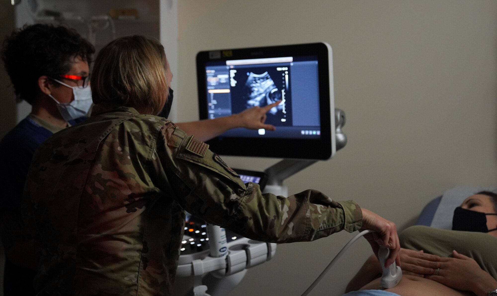 U.S. Air Force Maj. Jessica Cruz-Fehr, 673d Surgical Operations Squadron certified nurse midwife, assists as U.S. Air Force Col. Kirsten Aguilar, Joint Base Elmendorf-Richardson and 673d Air Base Wing commander, performs an ultrasound on U.S. Air Force Tech. Sgt. Morissa Barnes, 673 SGCS Women’s Health technician, during a 673d SGCS immersion tour at Joint Base Elmendorf-Richardson, Alaska, Sept. 29, 2020. Aguilar familiarized herself with the 673d SGCS and its role in supporting readiness after taking command of the installation July 14, 2020. The 673d SGCS provides a full range of medical care to include surgical and non-surgical intervention to JBER and the greater Anchorage area.