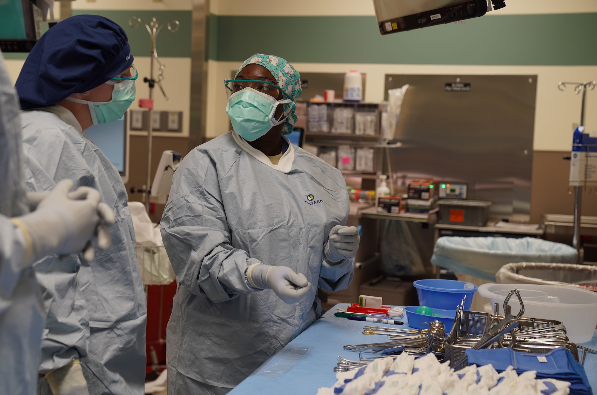 U.S. Air Force Airman 1st Class Lixa Auciel, 673d Surgical Operations Squadron surgical technician, explains to U.S. Air Force Col. Kirsten Aguilar, Joint Base Elmendorf-Richardson and 673d Air Base Wing commander, how to assemble a surgical backfield during a 673d SGCS immersion tour at JBER, Alaska, Sept. 29, 2020. Aguilar familiarized herself with the 673d SGCS and its role in supporting readiness after taking command of the installation July 14, 2020. The 673d SGCS provides a full range of medical care to include surgical and non-surgical intervention to JBER and the greater Anchorage area.