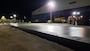 Contractors check the edging of a convrete test lane poured  on Sept. 1 for the Joint Base Pearl-Harbor Hickam F-22 Fighter Alert Facility project.