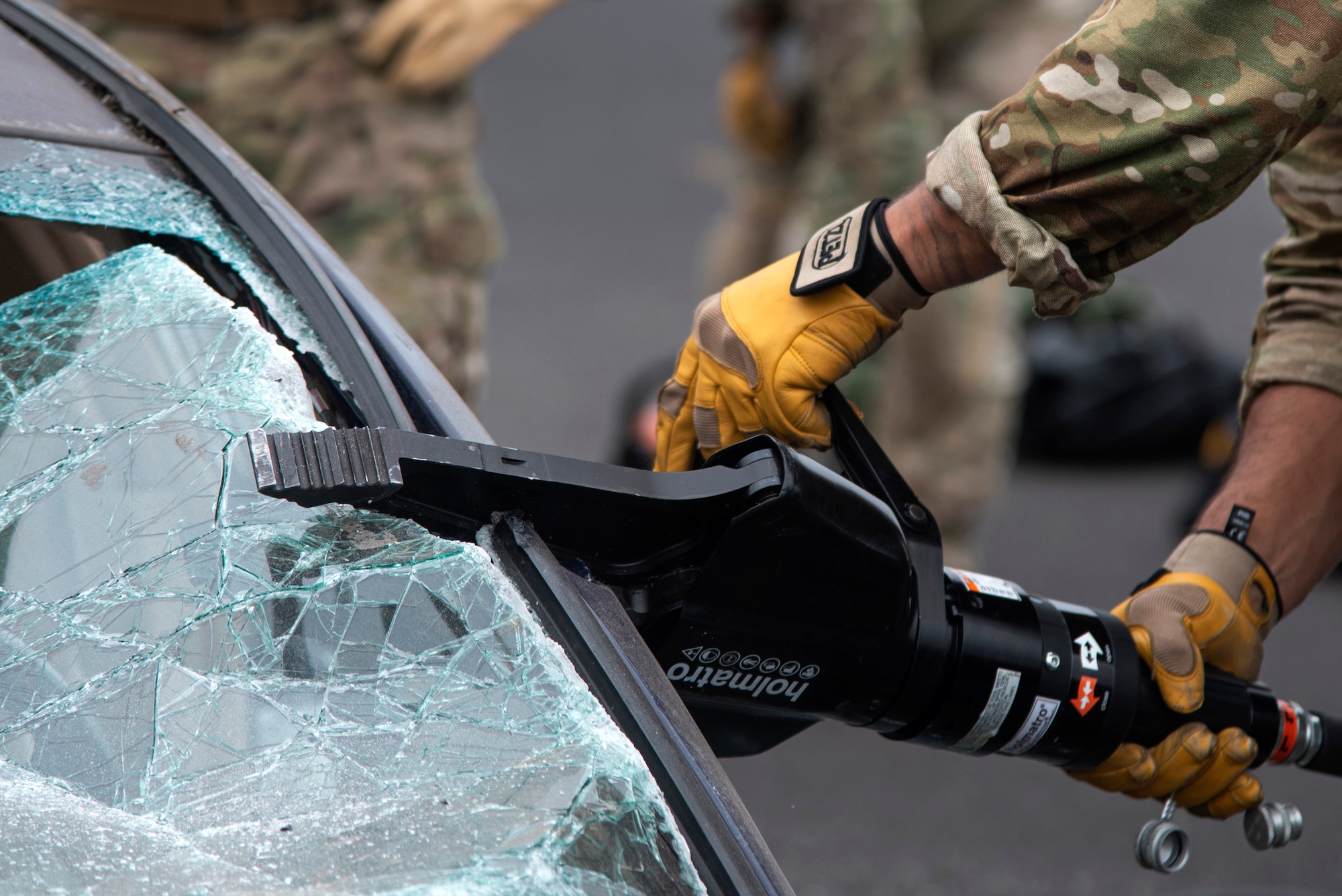 An Oregon Air National Guardsman from the 125th Special Tactics Squadron, uses a tool called the “jaws of life” to conduct extrication training at Portland Air National Guard Base, Portland, Ore., Oct. 8, 2020, to simulate removing trapped personnel from a car or aircraft. The training allowed members to utilize specialty tools in a controlled environment. (U.S. Air National Guard photo by Senior Airman Valerie R. Seelye)