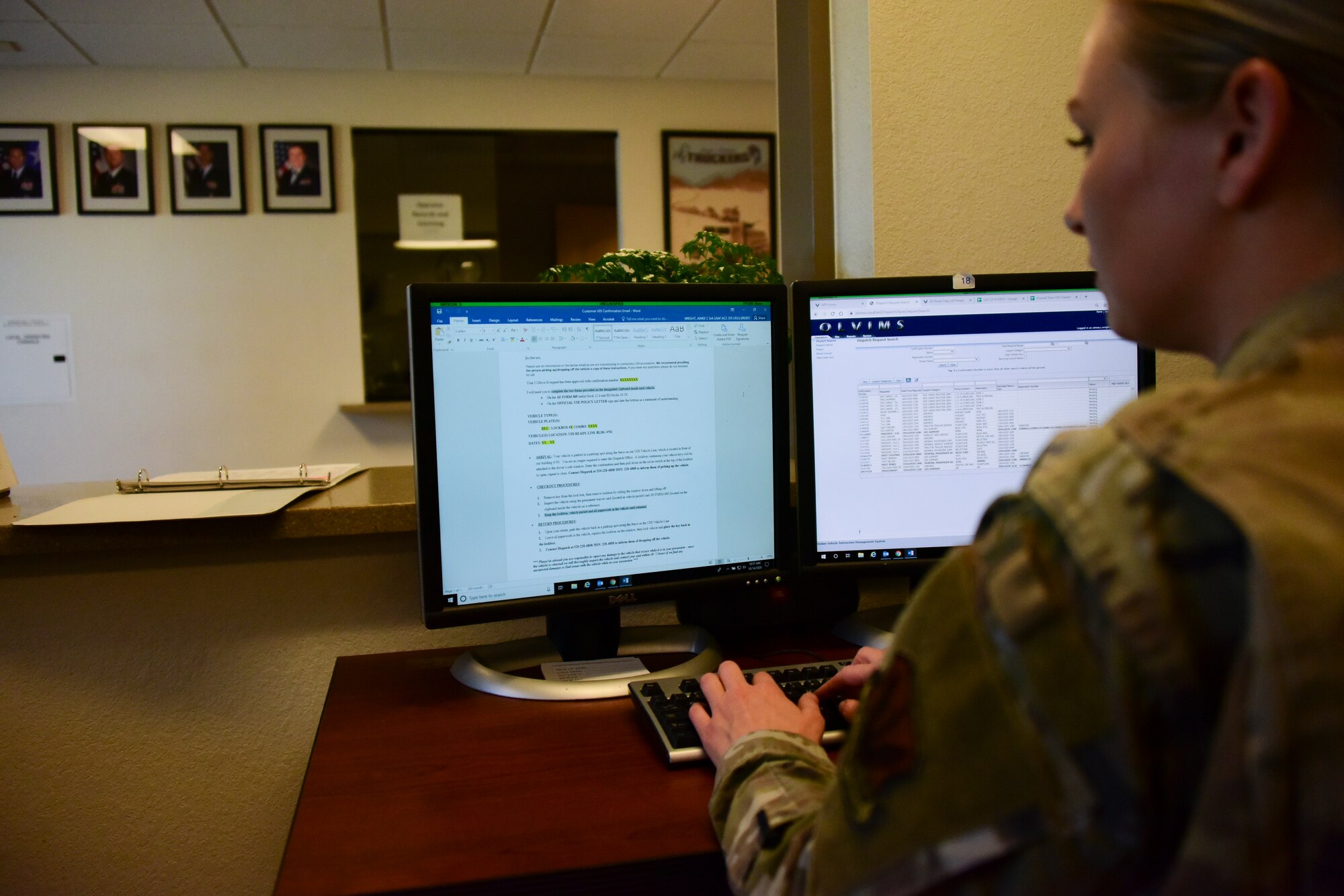 Picture of Airmen reviewing vehicle rental form