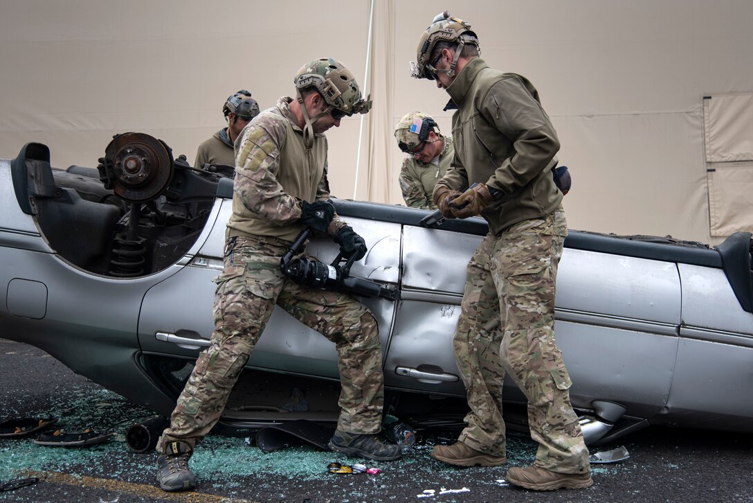 Oregon Air National Guard pararescuemen and combat controllers from the 125th Special Tactics Squadron conduct extrication training at Portland Air National Guard Base, Portland, Ore., Oct. 8, 2020, in order to simulate removing trapped personnel from a vehicle or aircraft. Training instructors gave the members specific procedures in order for the guardsmen to understand how to solve a complex problem. (U.S. Air National Guard photo by Senior Airman Valerie R. Seelye)