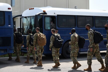 Basic military training graduates from Lackland Air Force Base, Texas, exit a commercial aircraft at Keesler Air Force Base, Mississippi, Sept. 29, 2020. BMT graduates used to be transported by bus from Lackland, but ever since COVID-19, they transitioned to being transported by aircraft to reduce the risk of infection among the students to keep the training pipeline going. (U.S. Air Force photo by Senior Airman Suzie Plotnikov)