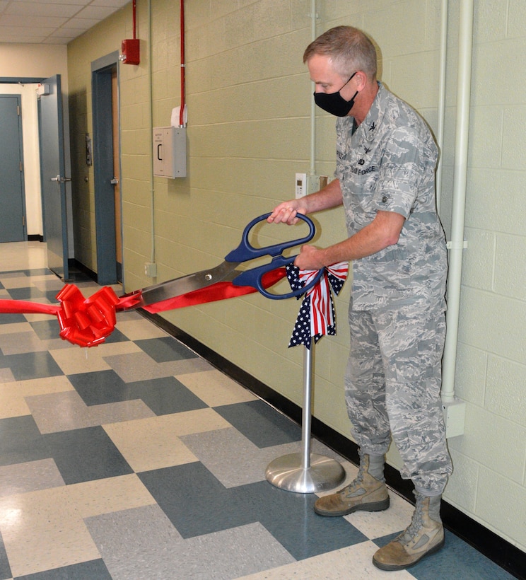 Col. Michael Warner, acting AFRL Materials and Manufacturing Directorate director, cuts a ceremonial ribbon during the grand opening of the new Special Test and Research, or STAR Lab, September 25. Courtesy photo.