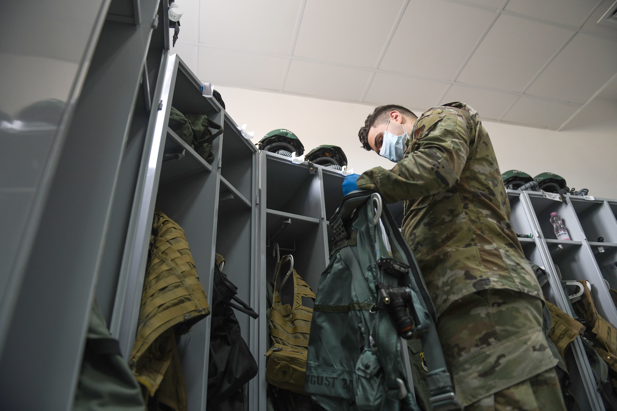 Airman 1st Class Matthew Giordano, 31st Operations Support Squadron aircrew flight equipment technician, inspects a harness during NATO enhanced Air Policing at Graf Ignatievo Air Base, Bulgaria, Oct. 13, 2020. NATO eAP is a specific assurance measure to demonstrate NATO’s solidarity, collective resolve, and its ability to adapt and scale its defensive missions and deterrence posture in response to the evolving security situation. (U.S. Air Force photo by Airman 1st Class Ericka A. Woolever)