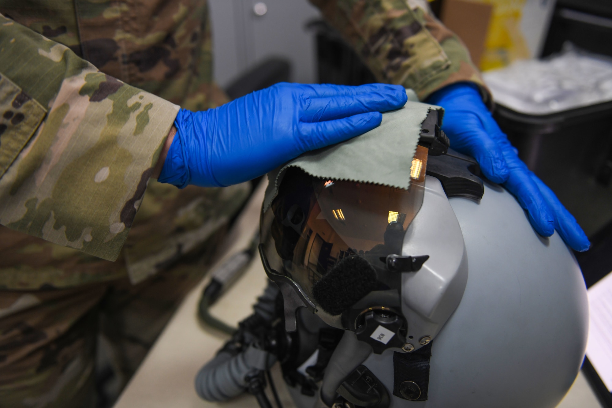 Airman 1st Class Matthew Giordano, 31st Operations Support Squadron aircrew flight equipment technician, cleans a display unit visor during NATO enhanced Air Policing at Graf Ignatievo Air Base, Bulgaria, Oct. 13, 2020. During NATO eAP Giordano is responsible for inspecting and maintaining life-saving equipment to include oxygen masks, life preservers, survival masks, anti-exposure suits, radios and recovery kits. (U.S. Air Force photo by Airman 1st Class Ericka A. Woolever)