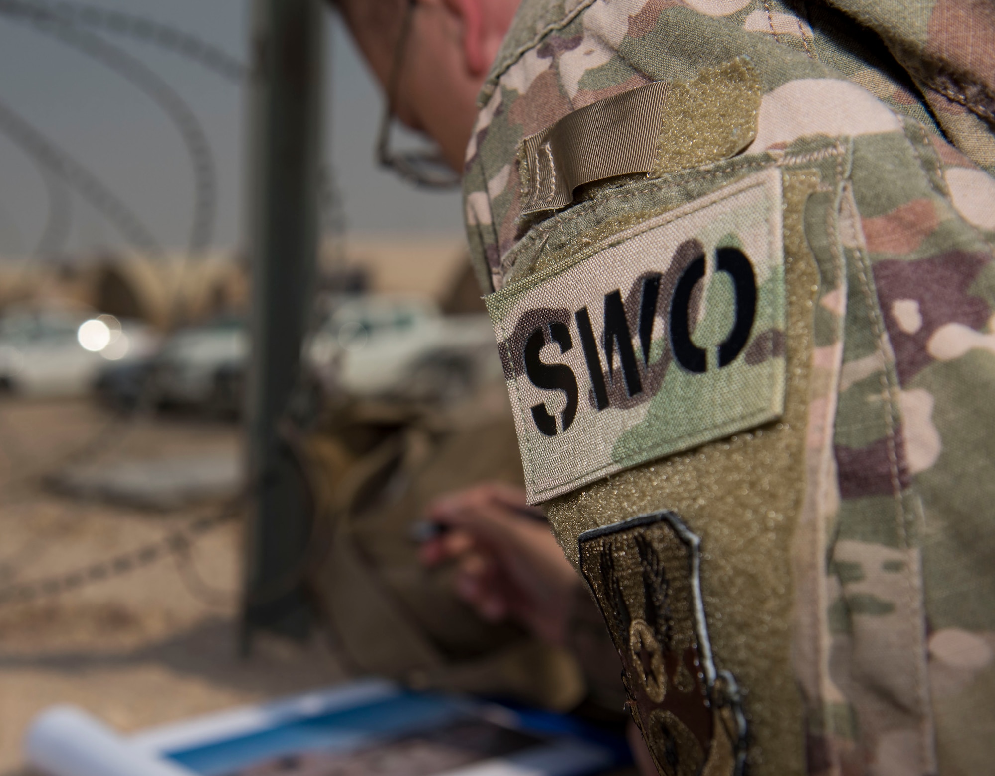 U.S. Air Force Tech. Sgt. Austin Medina, 22nd Expeditionary Weather Squadron non-commissioned officer in charge, records laser rangefinder statistics at Camp Buehring, Kuwait, Oct. 2, 2020.