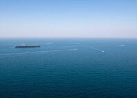 The aircraft carrier USS Nimitz (CVN 68) sails in the Arabian Gulf with Mark VI patrol boats attached to Task Force (TF) 56 and Bahrain Coast Guard ships, Oct. 11. TF 56 and the Nimitz Carrier Strike Group are deployed to the U.S. 5th Fleet area of operations in support of naval operations to ensure maritime stability and security in the Central Region, connecting the Mediterranean and Pacific through the Western Indian Ocean and three critical chokepoints to the free flow of global commerce.